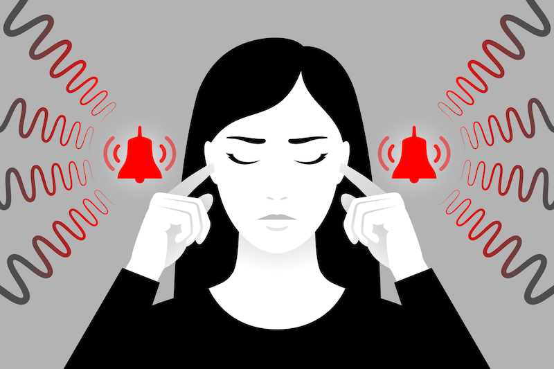 An illustration of a woman plugging her ears with fingers, suffering from tinnitus, red bells as symbol of unbearable ringing in ears.