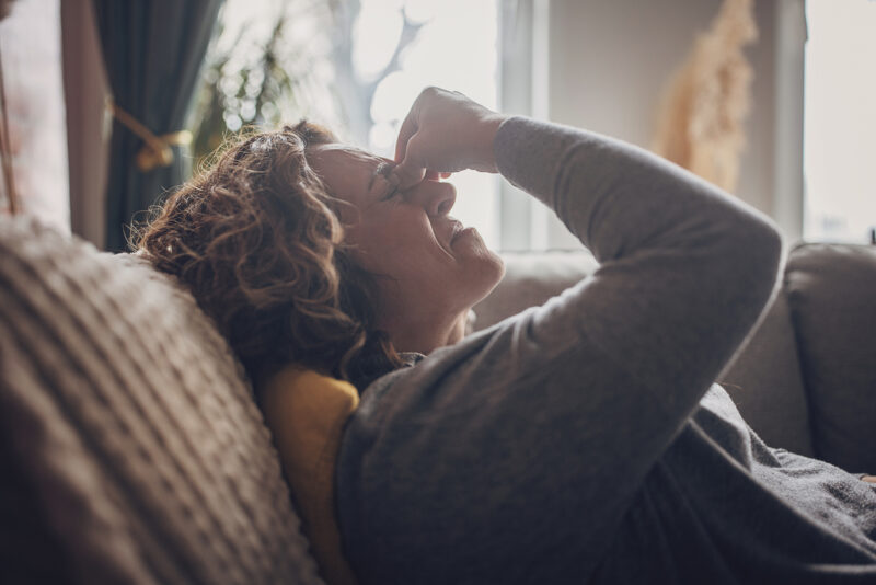 Woman in pain from vertigo or stress