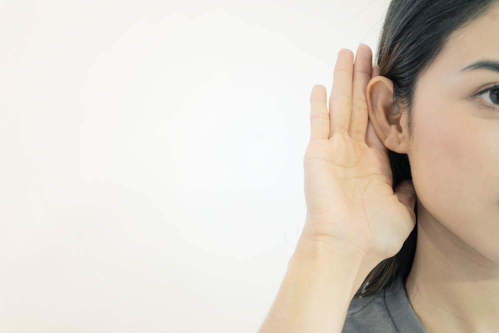 Lady struggling to hear.